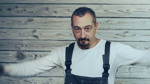 A worker dancing with a screwdriver Stock Footage 83236136