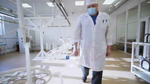 Worker is dealing with process of medical equipment test at production factory Stock Footage 187055219