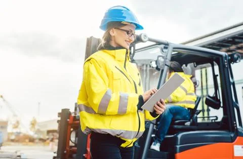 Worker in delivery center planning the logistics Stock Photos