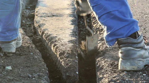 Worker dig trenches to lay cables for the airfield lighting system Stock Footage 57945298