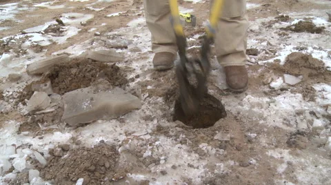 Worker digging hole for post Stock Footage 57714537