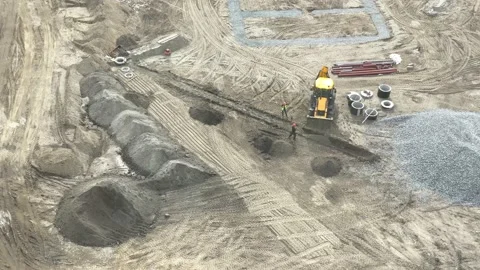 Worker digging trench at construction site Stock Footage 161328025