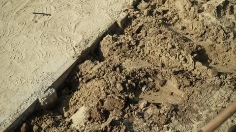 Worker Digs electric wires into the ground with a Shovel Video stock 258645928