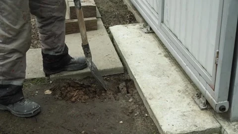 Worker Digs electric wires into the ground Stock Footage 268704815