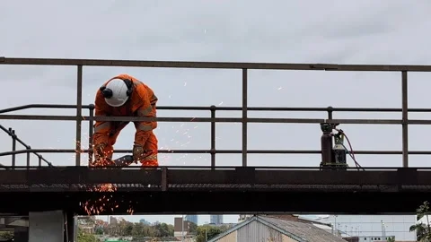 Worker Dismantling JCDecaux Billboard Structure During Railway Engineering Works Stock Footage 342350811