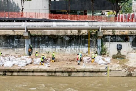 Worker doing constructions on the drains Stock Photos