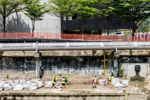 Worker doing constructions on the drains Stock Photos