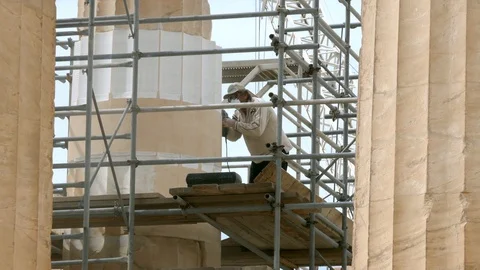 Worker doing historic preservation as part of Parthenon Restoration in Acropolis Stock Footage 129412084