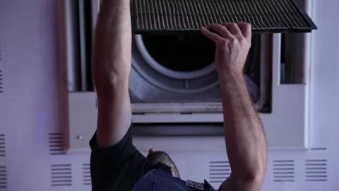 Worker doing maintenance Air Conditioner from the ceiling Stock Footage 102066567