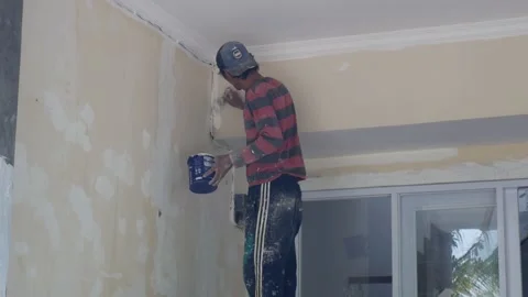 Worker doing paint a WALL Stock Footage 156941886
