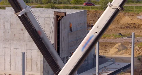 Worker doing work on the walls of the constructed workshop Stock Footage 161991085