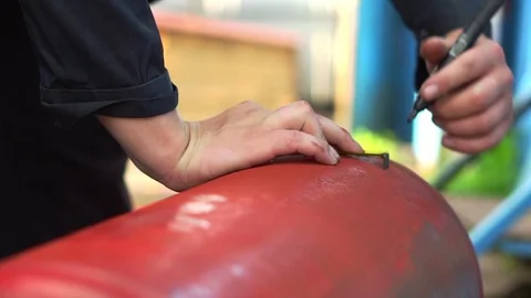 Worker draws a diagram on the workpiece Stock Footage 111049436