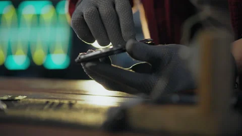 A worker dressed in protective gloves is repairing microcircuit components i Stock Footage 278246068