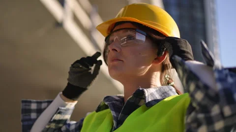 Worker Dressed in Safety Gear While Working on a Construction Site Today Stock Footage 311861162