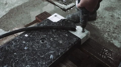 Worker drill hole in stone plate Stock Footage 68072043