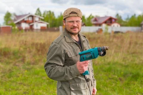 Worker with a drill Stock Photos