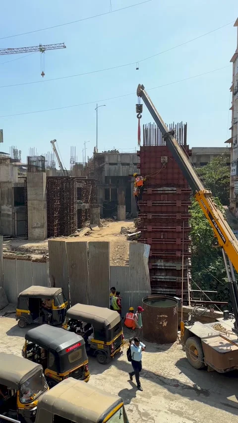 Worker Drilling Concrete Column at Job Site Stockbeeldmateriaal 333083386