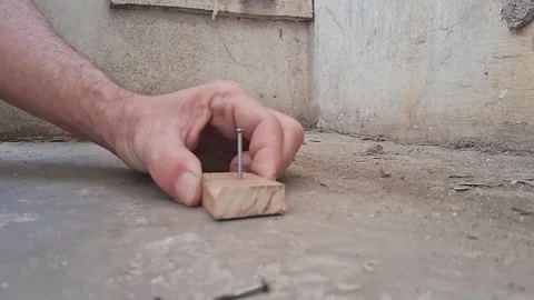 Worker drilling into concrete surface. Construction worker using power drill for Stock Footage 340922455