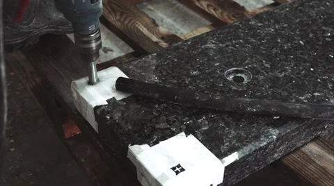 Worker drilling a hole in stone plate Stock Footage 68071986