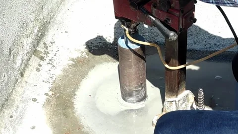 Worker Drilling Hole Through the Floor with the Core Drill Machine Video Stock Stock Footage 320421808