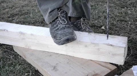 Worker drilling holes with electrical drill in a piece of wood Stock Footage 59682047