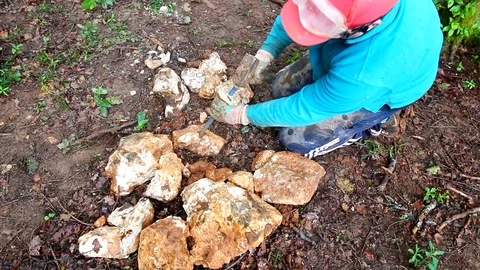 Worker drilling rocks with a hammer and a driller. Stock Footage 109306710