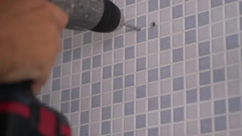 Worker drilling a wall tile Stock Footage 166211552