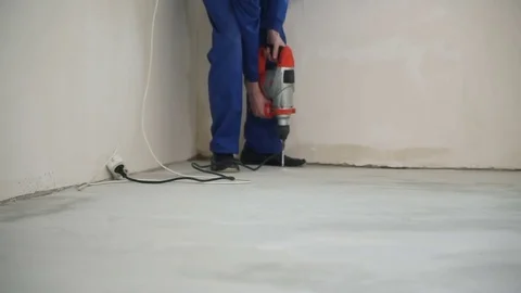 The worker drills the floor Vídeo Stock 73394459
