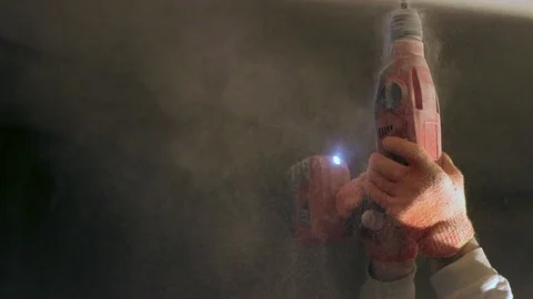 Worker drills a hole in the ceiling, building, repair Stock Footage 88088211