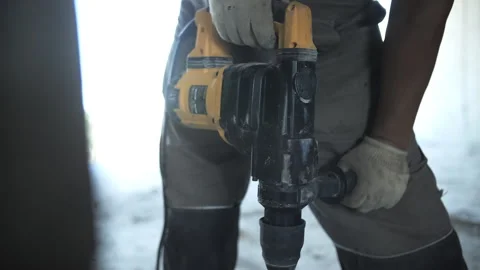 Worker drills a hole in concrete Stock Footage 282240671
