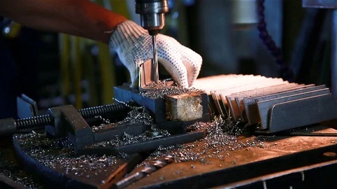 A worker drills a hole Stock Footage 97750033