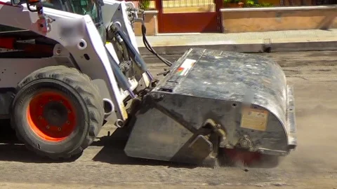 Worker driver Skid steer remove Worn Asphalt during repairing Road Works Stock-Footage 73605413