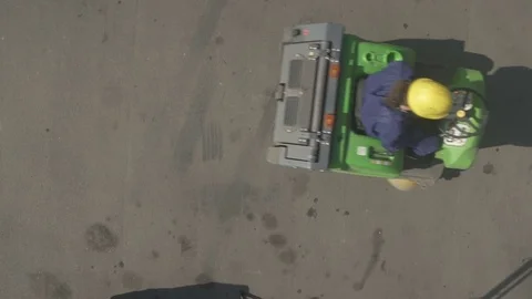 Worker drives sweeper left to right Video stock 79161437