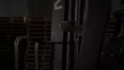 Worker is driving the elecric forklift. Loader and wooden pallet with boxes when Stock Footage 163434554