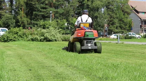 Worker Driving Lawn Mower Stock Footage 46129190
