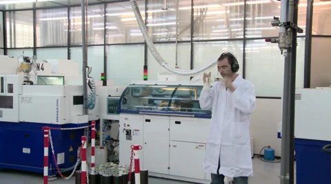 Worker by a DVD stamper Stock Footage 33820454