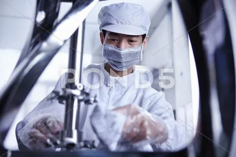 Worker At E-Cigarettes Battery Factory, Guangdong, China