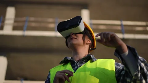 A worker effectively using advanced virtual reality technology on a modern  Stock Footage 311861342
