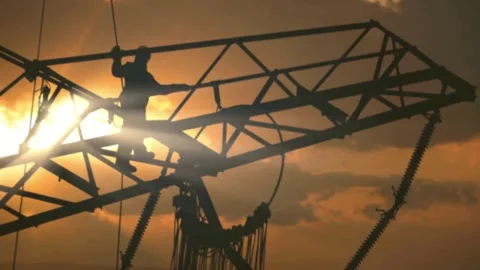 Worker on an Electric Pylon at Sunset Stock Footage 276298174