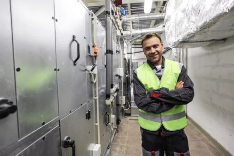 Worker in electrical switchgear room Stock Photos