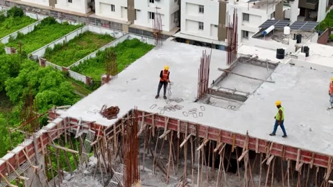 Worker engaged in construction activities at an active construction site Stock-Footage 344021437