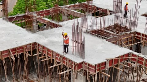 Worker engaged in construction activities at an active construction site Stock-Footage 344021449