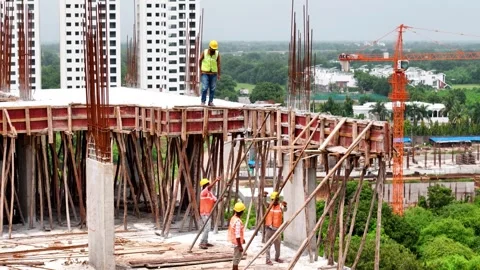 Worker engaged in construction activities at an active construction site Stock-Footage 344021467