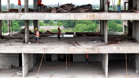 Worker engaged in construction activities at an active construction site Stock-Footage 344021508