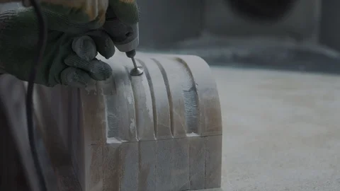 Worker engraving marble with electrical engraver, visible stone dust, closeup 스톡 동영상 99039119