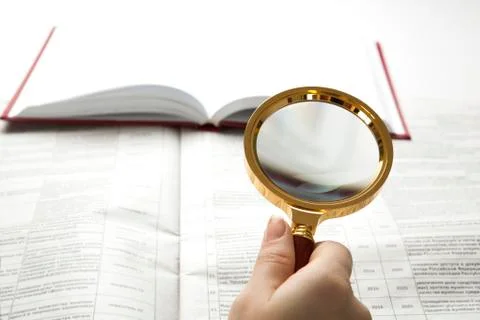 Worker examines a magnifying glass text Stock Photos