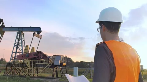 The Worker Examines Oil Pump Stock Footage 68943932