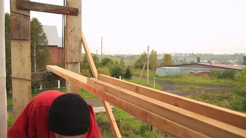 A worker on the facade of the house Stock Footage 79912775