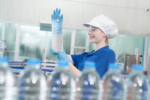 Worker in factory checking water Stock Photos