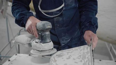 A worker at the factory performs surface grinding with a special tool Stock Footage 155210683